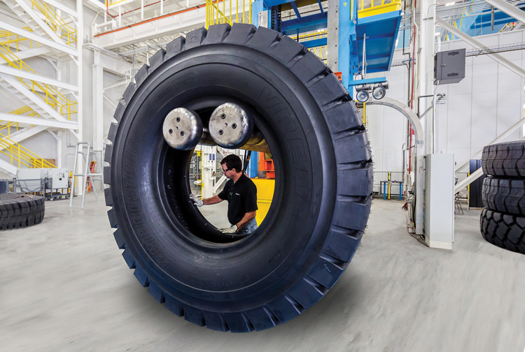 A technician performs a visual inspection at the new Aiken tire plant.