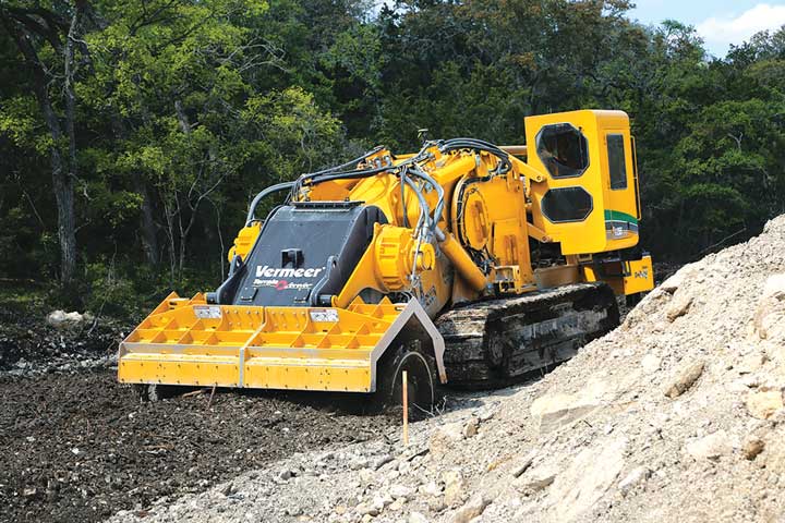 Because it produces an acceptable final particle size on its own, a surface excavation machine eliminates several steps normally needed to produce adequate road construction material, including drill and blast, crushing and stockpiling, and the hauling of in situ material for processing.