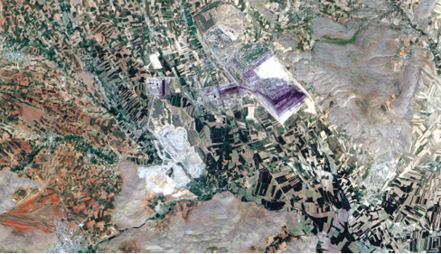 NASA photo of the Çöllolar lignite mine wall failures, which took place in 2011. The major failure on the northeast side of the pit was the second within a week; the failure zone extended some 350 m beyond the existing pit perimeter. Kislaköy, on the right side of the image, reportedly suffered a pit-wall failure in 2006.