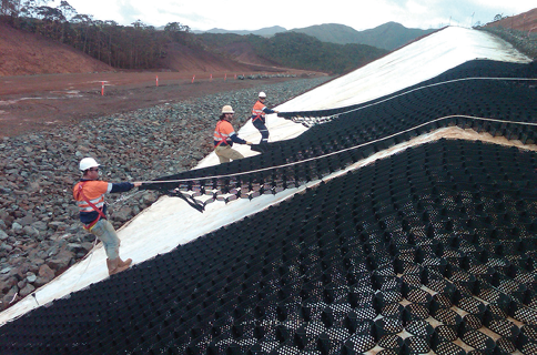 Installing Presto Geosystems’ Geoweb cellular slope reinforcement at Vale’s Goro nickel mine in New Caledonia.